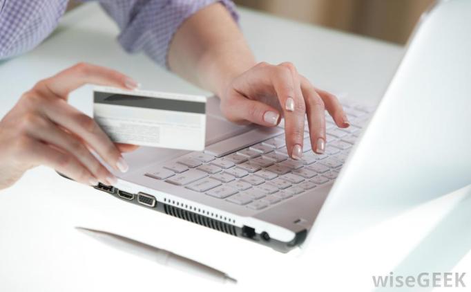 a-woman-at-computer-with-credit-card